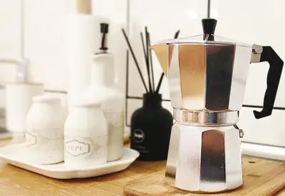a blender sitting on a table with other bottles at Prime Location Apartment Vilnius in Vilnius