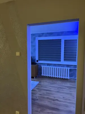 a view of a room with a window and a radiator at KRL&Lu Rentals in Panevėžys