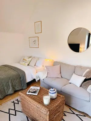 a living room with a couch and a table at Private, Cozy Home in Kaunas