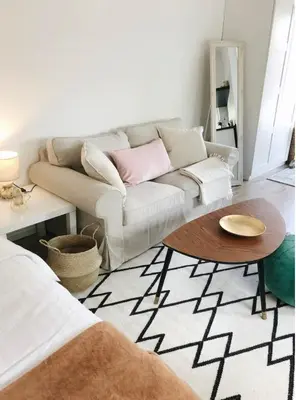 a living room with a couch and a table at Private, Cozy Home in Kaunas