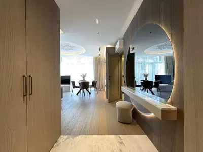 a hallway with a living room and a dining room at Žaliakalnis Luxury Suites in Kaunas