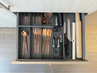 a cabinet filled with lots of kitchen utensils at Žaliakalnis Luxury Suites in Kaunas