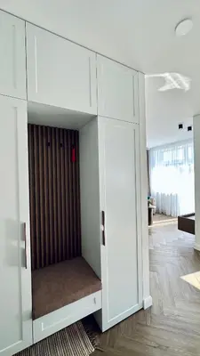 a room with a white cabinet with a closet at Šviesus ir šiltas butas Šiaulių miesto centre in Šiauliai