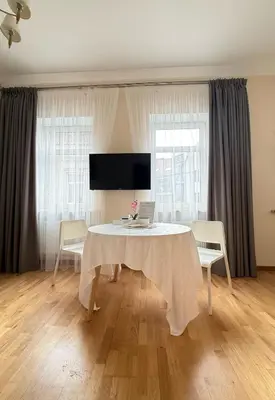 a dining room with a table and two chairs at Old Town Hideaway in Kaunas