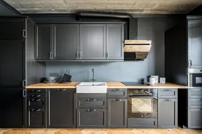 a kitchen with gray cabinets and a white sink at City Center Panoramic Penthouse With Rooftop Terrace - Self Check-in in Vilnius