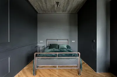 a bed in a room with a black wall at City Center Panoramic Penthouse With Rooftop Terrace - Self Check-in in Vilnius