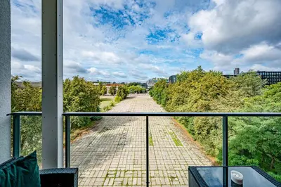 a view of a brick road from a balcony at City Center Panoramic Penthouse With Rooftop Terrace - Self Check-in in Vilnius