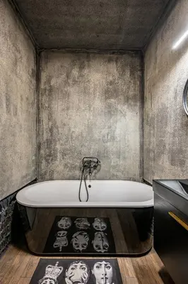 a bathroom with a bath tub with a poster of actors at City Center Panoramic Penthouse With Rooftop Terrace - Self Check-in in Vilnius