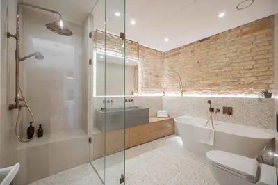 a bathroom with a shower and a tub and a sink at 2 Bedroom I 85 m2 I w-Balcony I Malunu st Apt I cohost in Vilnius