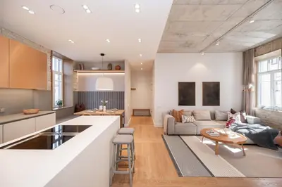 a kitchen and living room with a couch and a table at 2 Bedroom I 85 m2 I w-Balcony I Malunu st Apt I cohost in Vilnius