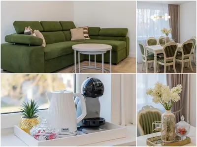 a living room with a green couch and a table at Frida Luxury Apartments in Šiauliai