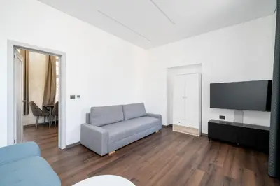a living room with a couch and a flat screen tv at Modern Flat in Centre, Self Check-In, Free parking in Vilnius