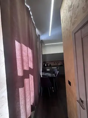 a room with a table and a room with a door at Modern Flat in Centre, Self Check-In, Free parking in Vilnius