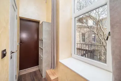 a room with a window and a door at Modern flat , Self check in 24h, Netflix, parking in Vilnius