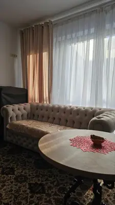 a living room with a couch and a coffee table at Butas su terasa Kauno centre pirmame aukšte Clinic in Kaunas