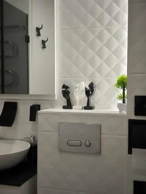a bathroom with a sink and a toilet and a mirror at DOMINO apartamentai, SELF CHECK-IN in Panevėžys