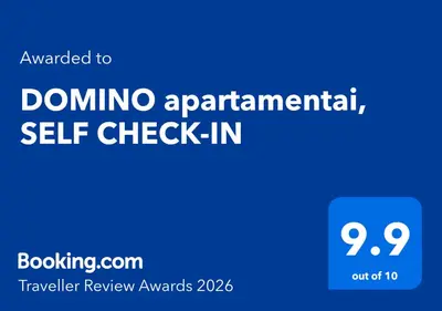 a blue sign with the words dominoascist self check in at DOMINO apartamentai, SELF CHECK-IN in Panevėžys