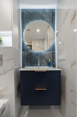 a bathroom with a sink and a mirror at 60 Loft in Vilnius