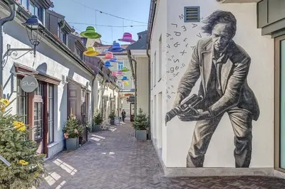 a mural of a man painted on the side of a building at New! Luxury Old town apartment in Vilnius