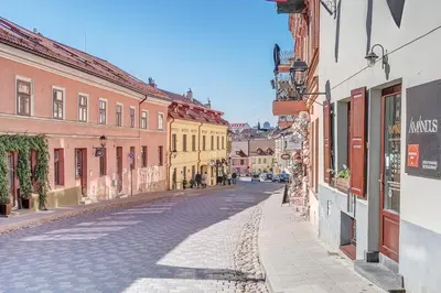 an empty street in an old town with buildings at New! Luxury Old town apartment in Vilnius