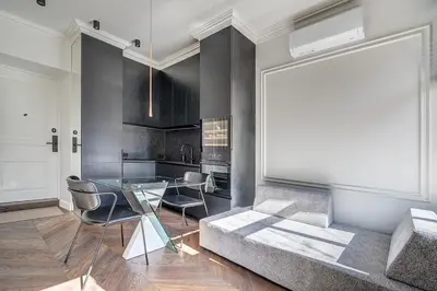 a living room with a couch and a glass table at New! Luxury Old town apartment in Vilnius