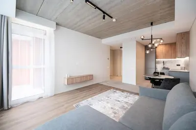 a living room with a couch and a table at Luxury apartment near downtown in Vilnius