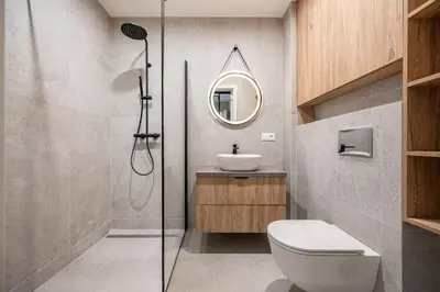 a bathroom with a shower and a toilet and a sink at Luxury apartment near downtown in Vilnius