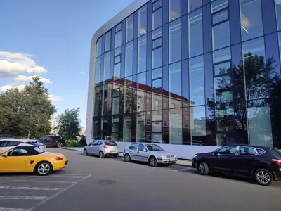 a group of cars parked in front of a building at GoodStopCenter in Vilnius