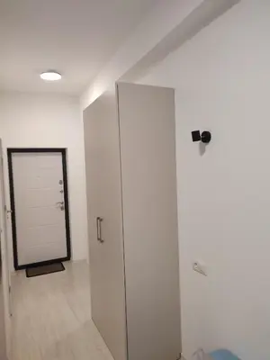 a room with a white closet and a door at GoodStopCenter in Vilnius