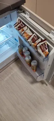 an open refrigerator with some food in it at GoodStopCenter in Vilnius