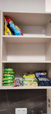 a shelf filled with different types of cloths at GoodStopCenter in Vilnius