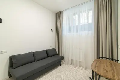 a living room with a couch and a table at ShortStopStudent in Vilnius