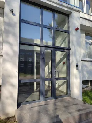 an entrance to a building with a glass door at ShortStopStudent in Vilnius