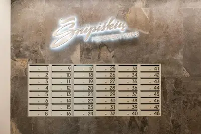 a periodic sign on a wall with a periodic table at City Center Apartamentai Šatrijos g in Vilnius