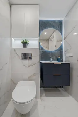 a bathroom with a toilet and a sink and a mirror at Loft 60 with Free parking in Vilnius