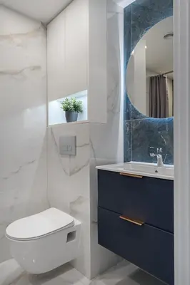 a bathroom with a toilet and a sink and a mirror at Loft 60 with Free parking in Vilnius