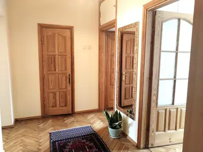 a room with an open door and a mirror at Heart of Kaunas Apartament in Kaunas