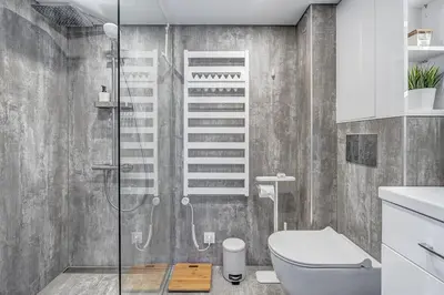 a bathroom with a shower and a toilet at Modern Studio near the city center in Vilnius