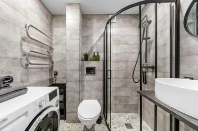 a bathroom with a shower and a toilet and a sink at Bright, cozy apartment 5 min walk to Old town in Vilnius