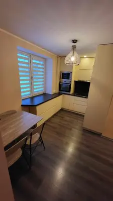 an empty kitchen with a table and a window at Patogus poilsis in Ignalina