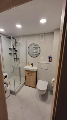 a bathroom with a shower and a toilet and a sink at Patogus poilsis in Ignalina