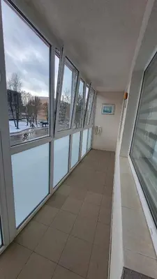 an empty room with large windows in a building at Patogus poilsis in Ignalina