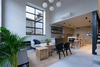 a living room with a couch and a table at citywave Vilnius in Vilnius