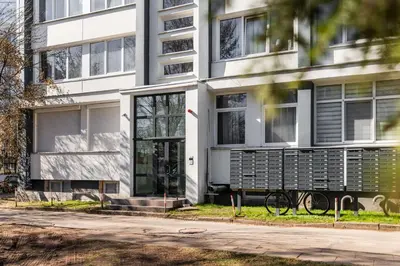 a building with a bike parked in front of it at Fox Rock Studio - Self check in in Vilnius