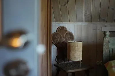 a basket sitting on a shelf in a room at Molinis ir Medinis in Ažuluokesa