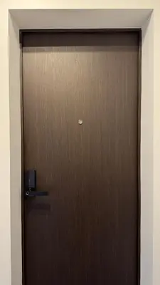 a wooden door in a room at EVA boutique apartments in Vilnius