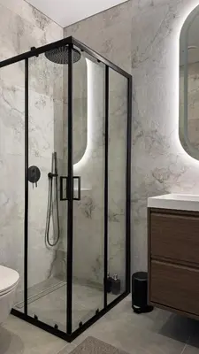 a bathroom with a shower and a toilet and a sink at EVA boutique apartments in Vilnius