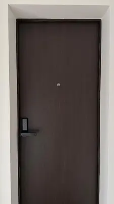 a brown door with a sign on it at EVA boutique apartments in Vilnius