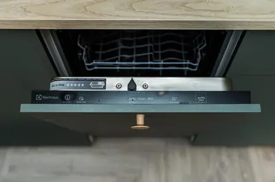 an oven with a book sitting on top of it at Cozy Piliamiescio Apartament No 2 by URBAN RENT in Kaunas