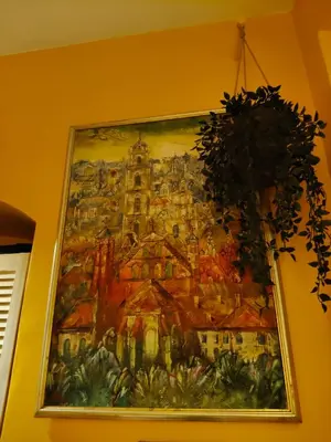 a painting of a building on a wall at Aušros Vartai in Vilnius